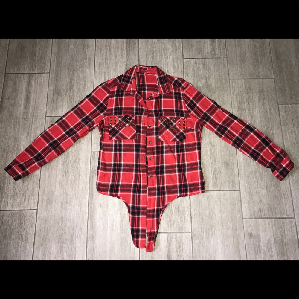 A red, plaid, button-down top with rhinestones.